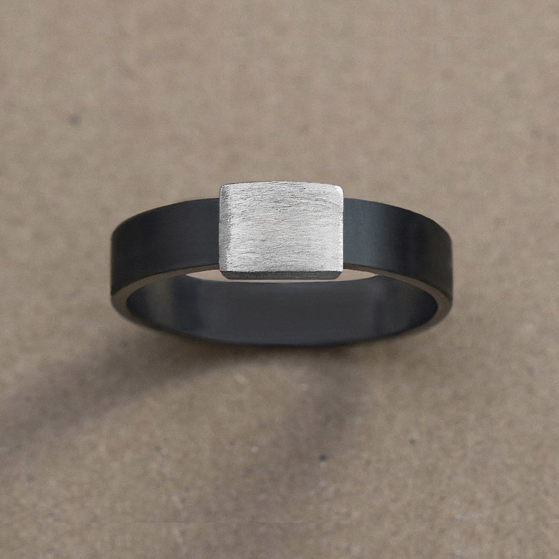 5mm Silver Platinum Barrel Band Wedding Ring on kraft paper