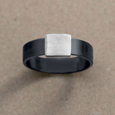 7mm Silver Platinum Barrel Band Wedding Ring on kraft paper