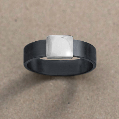 7mm Silver Platinum Barrel Band Wedding Ring on kraft paper