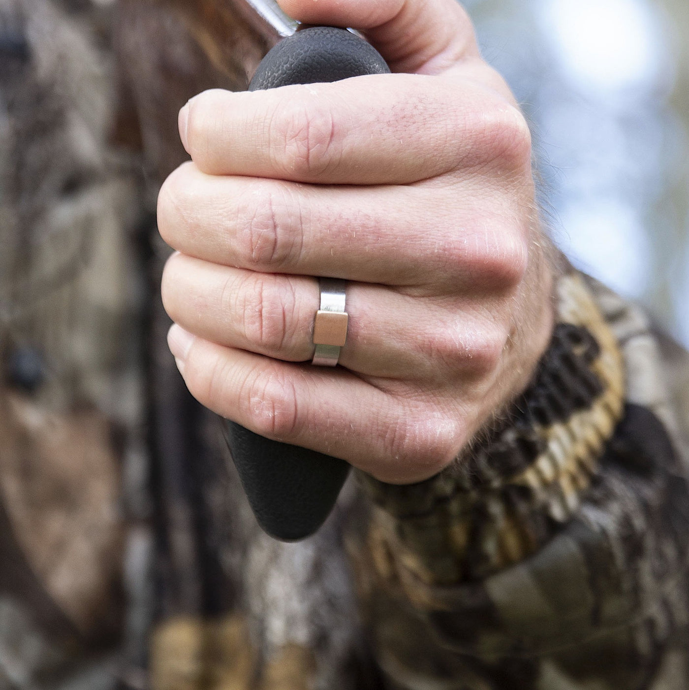 Barrel Band - Gunmetal Rose Gold with Brushed Finish Holding Shotgun